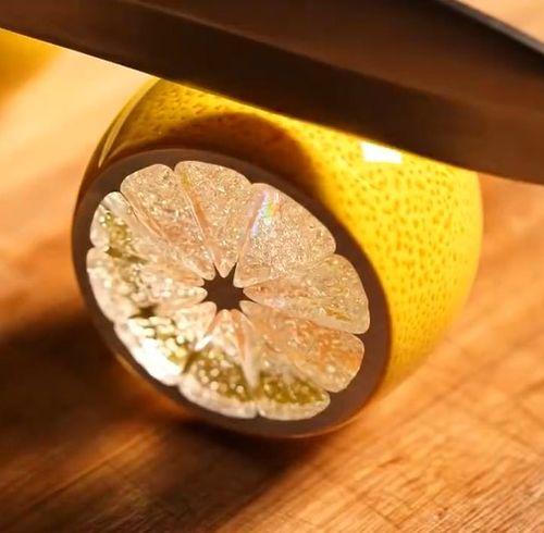 Create an ASMR video prompt for glass Orange